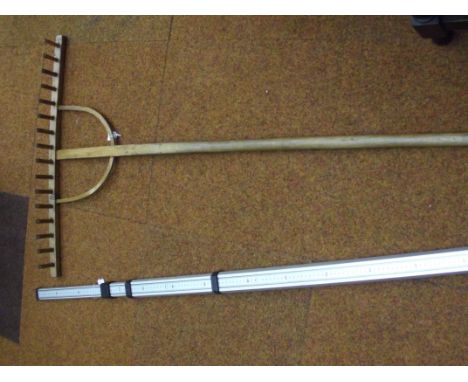 Vintage wooden rake and 500 cm measuring stick 