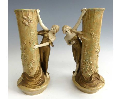 Theodore Schoop for the Bernhard Bloch Factory - a pair of Austrian Art Nouveau ceramic vases, modelled as Belle Epoque maide