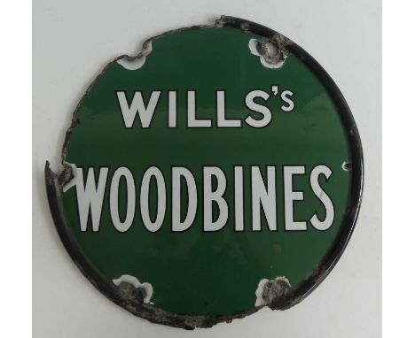 A circular enamel on metal advertising sign for Wills's Woodbines, dia.45.5cm; together with a pair of ESSO enamelled metal f