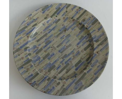 David Lloyd Jones (1928-1994) - an extremely large studio pottery charger, of typically circular slightly dished form, painte
