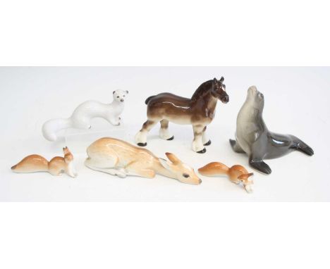 A collection of six 'Made in USSR' glazed ceramic animal figures, to include; horse, seal, recumbent fawn, two squirrels, and