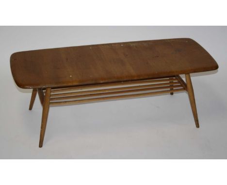 A 1960s Ercol blond elm low coffee table, having rounded corners and laddered undertier, labelled to underside, h.36cm, lengt