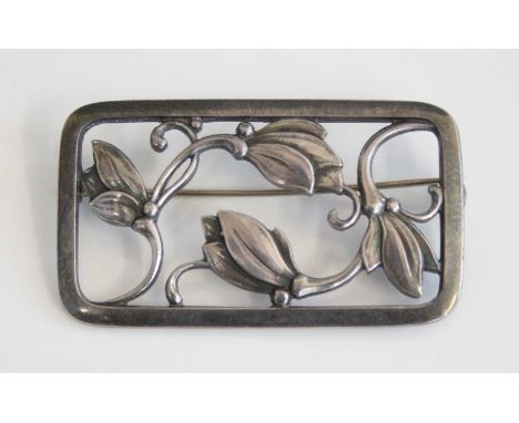 Georg Jensen (1866-1935) - a sterling silver rectangular openwork panel brooch, depicting stylised flowers, with roller catch