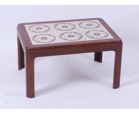 A 1960s G-Plan teak and tile topped inset low occasional table, raised on slightly rounded and pinched supports, h.39.5cm, le