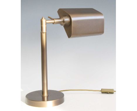 A contemporary brushed brass bankers desk lamp, with adjustable shade and branch arm, raised on integral cylindrical base, h.