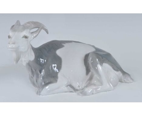 Christian Thomsen (1860-1921) for Royal Copenhagen - a recumbent goat, model 466, glazed porcelain, incised signature and fur