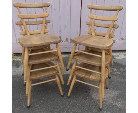 A set of six 1960s Ercol child's blond elm green dot stacking chairs, each with twin bar backs, w.33cm