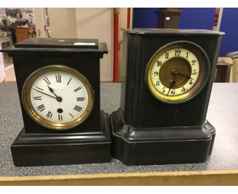 Two black slate mantel clocks: one by Barraud & Lund