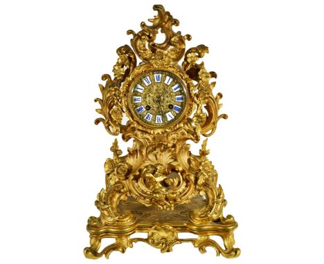 A 19th Century French Mantel Clock:With gilded floral scroll case and a faun playing cymbals below the dial, the dial with ap