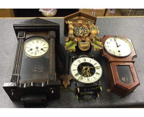 Four wallhanging clocks to inc a cuckoo clock example