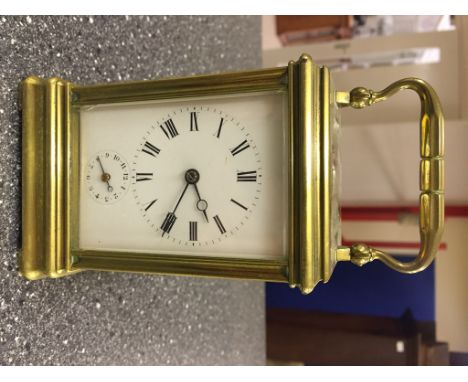 A 19th century alarm carriage clock striking on bell