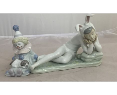 A Lladro clown with dog on lap; together with a Nao boy in bunny outfit