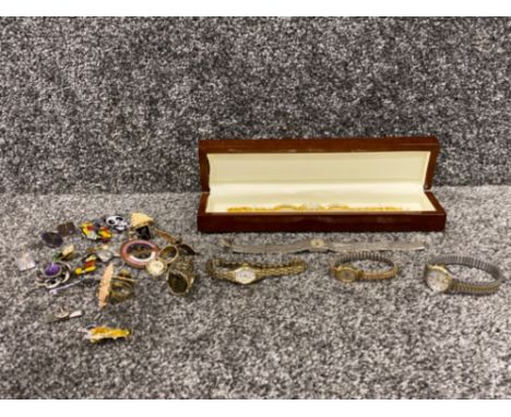 Ladies wristwatches by Timex, Swiss Empress and Hana, and a collection of badges including Spider-Man and Mickey Mouse