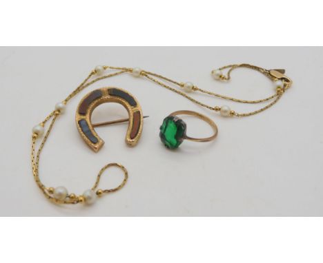 A 9ct gold Scottish agate horseshoe brooch, 2.5cm x 2.3cm, a 9ct and silver mounted green glass ring, and a 9ct clasp on a co