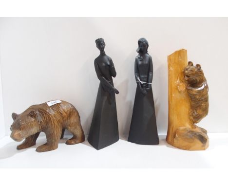 Two carved black forest bears, one modelled climbing a trunk, and two Royal Doulton figures Contemplation and Sympathy Condit