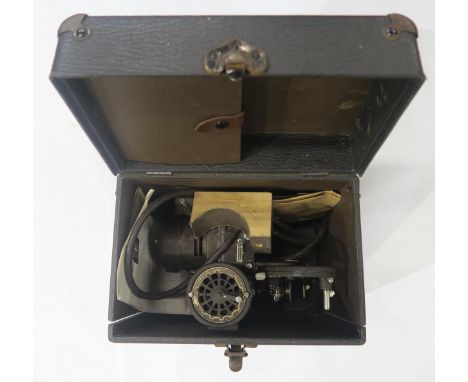 A cased Bell &amp; Howell Filmo-Master 400 cine-projector, together with a boxed folding projector screen Condition Report:Av