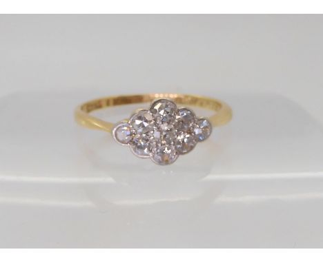 An 18ct gold vintage diamond cluster ring, set with estimated approx 0.45cts, finger&nbsp; size M, weight 1.6gms Condition Re