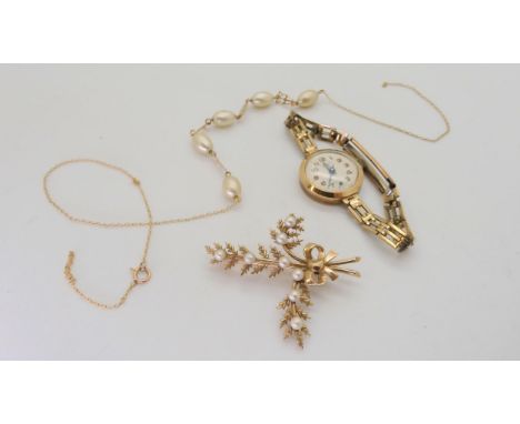 A collection of 9ct gold and yellow metal items to include a pearl set brooch, a Lanco 9ct watch head and a faux pearl yellow