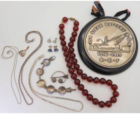 A WW1 wall plaque for the '154 Siege Battery RGA 1916- 1919', together with a string of cherry amber coloured beads, a Celtic