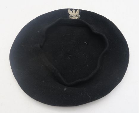 A pre-War Polish Other Ranks black wool beret, with embroidered Polish Eagle patch Condition Report:Available upon request