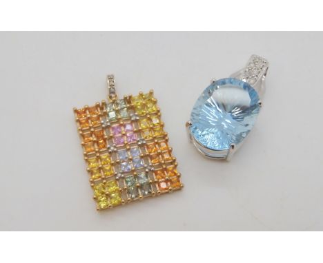 A 9ct white gold fancy cut large blue topaz pendant, length 3cm, and a 9ct diamond accent and multi gem set pendant length 3.