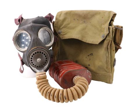 A Second World War British army gas mask and haversack