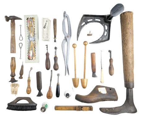 Vintage cobbler's lasts and a quantity of related tools, including a brass and boxwood foot measuring gauge, bunion stretcher