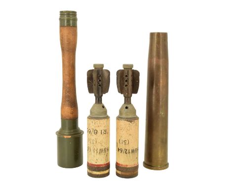 A 1944 British 40 mm Oerlikon anti-aircraft gun shell case together with two inert post-War 2-inch mortar illuminating rounds