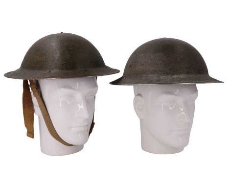 A Second World War British army Mk II steel helmet, its shell inscribed with its original RASC owner's name and number, toget