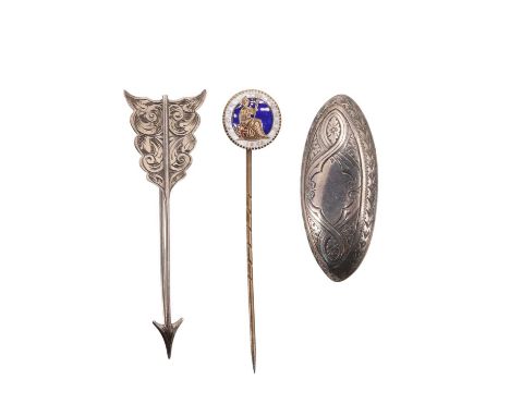 Two late 19th / early 20th Century white metal brooches, comprising an oblate brooch having Victorian gothic influenced engra