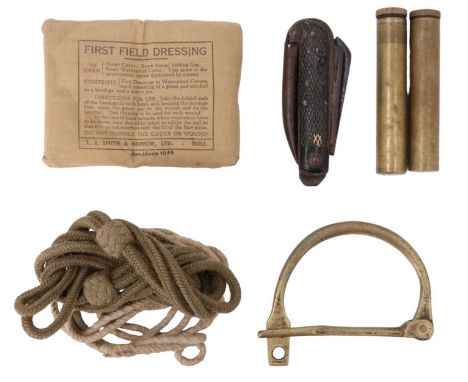 A 1945 First Field Dressing together with a revolver lanyard, two rifle oil bottles, a white lanyard, a clasp knife and a kit