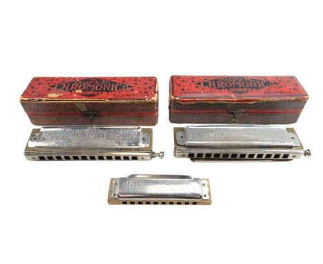 Two boxed 1930s "The Super Chromonica" together with a Blues Harp harmonica / mouth organ by M Hohner