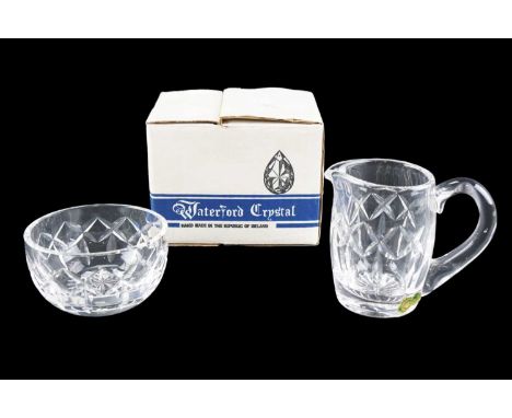 A boxed Waterford Crystal cream jug sugar basin