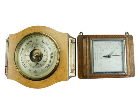 A 1960s birdseye maple aneroid barometer by O Comitti of London, having a thermometer and storm glass, together with a 1930s 