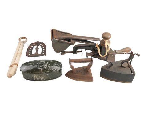 A quantity of kitchenalia, including a 'Magic' marmalade cutter, a potato ricer, sad and box irons, etc