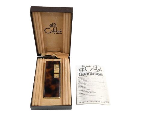 A cased 1980s Colibri gas cigarette lighter