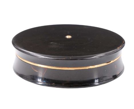 An early 19th Century French 18 ct yellow metal mounted tortoiseshell 'erotic' snuff box, of waisted disc form, having a slip