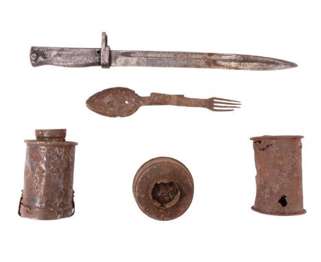 A Great War German ersatz bayonet together with battlefield-recovered German stick grenade heads, a gas mask filter and foldi