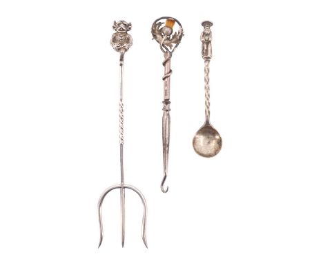 An Edwardian thistle top silver button hook, set with a faux cairngorm, a novelty silver pickle fork, having an imp terminal,