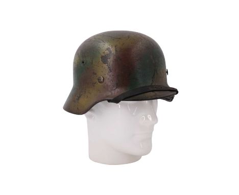 A German Third Reich army M '40 steel helmet bearing a "Normandy" three-colour sprayed camouflage paint finish