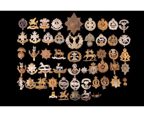 A quantity of British army cap badges etc