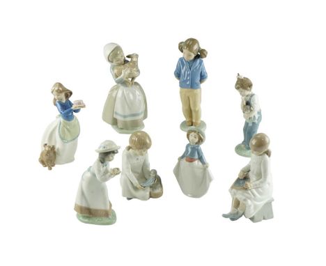 Eight Nao figurines, including girl with lamb, girl with doll, etc, tallest 23 cm