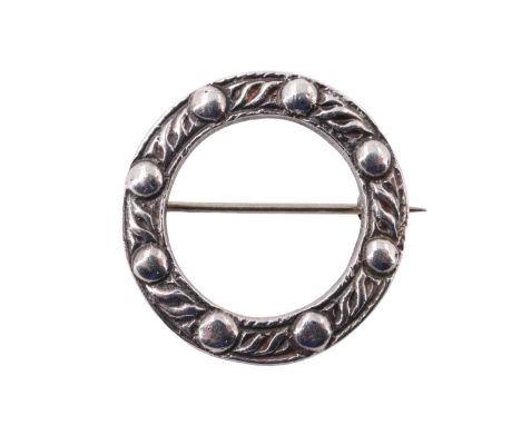 A Scottish silver brooch by Robert Allison, being an annulus with cast Celtic decoration, Glasgow, 1956 5.17 g, 25 mm diamete