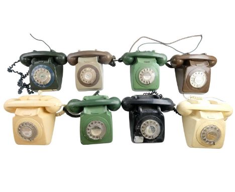 Eight 700 series rotary dial telephones, models 706 L, 706 F, 746 GNA and 746 GEN