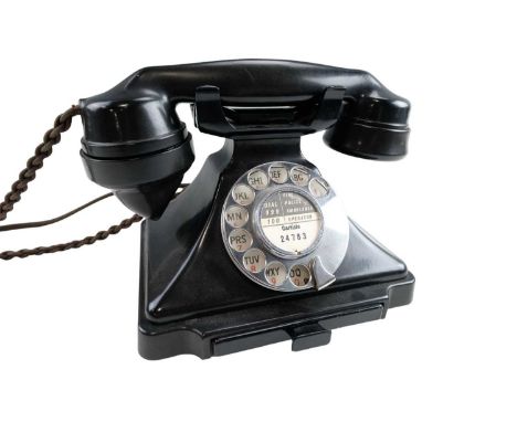 A Bakelite rotary dial telephone model '1/232 CB', having a number drawer and fitted with a later 431A plug