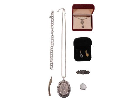 A quantity of silver and white metal jewellery, including a floral engraved and embossed locket, a horn handled 'Kukri' tie c