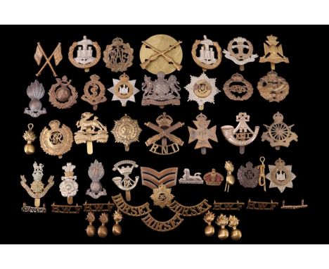A small collection of British army cap and other badges including Army Cyclist Corps and Tank Corps badges