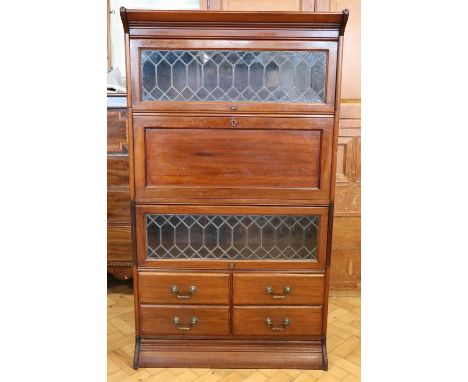 A George VI mahogany and leaded glass Globe Wernicke lawyer's bookcase, having a secretaire and four drawer modules, 87 x 36 