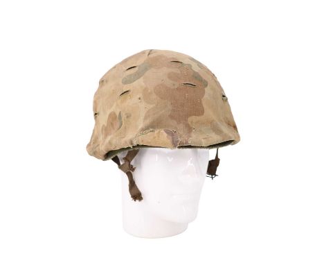 A post-War US army paratroop helmet and camouflage cover