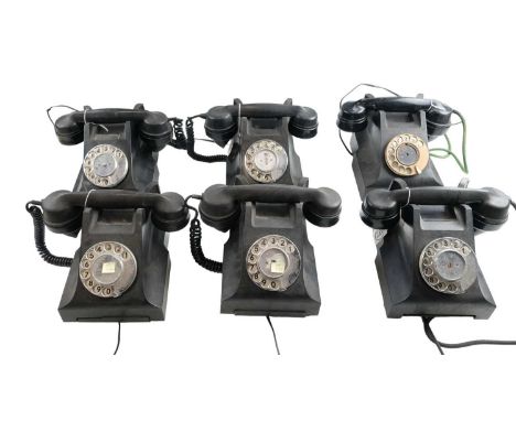 Six 1940s Bakelite 300 series rotary dial telephones, having later 431A plugs